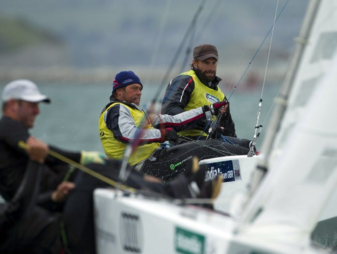 Iain Percy and Andrew Simpson, (GBR) racing in the Star class on day 6 of the Skandia Sail for Gold Regatta, in Weymouth and Portland, 2012, once again wearing the series leader’s yellow vests. © onEdition http://www.onEdition.com